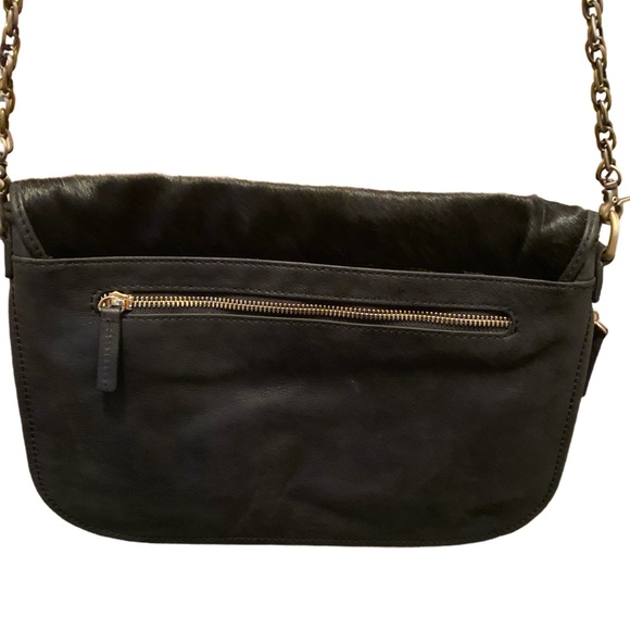 CLIO GOLDBRENNER--leather leopard print Crossbody with gold metal accents.